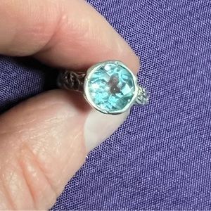 Sz5 Sterling silver 925 band with blue topaz solitaire.